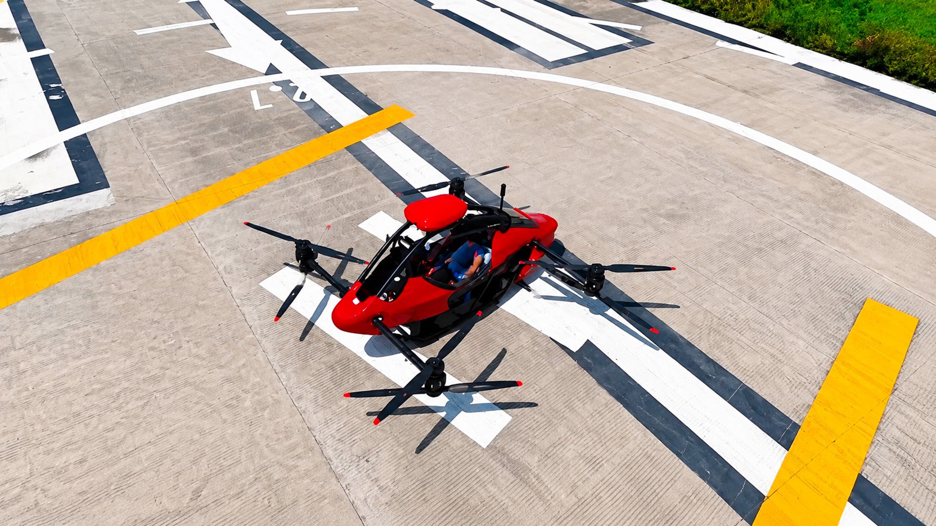 Red eVTOL aircraft parking lot